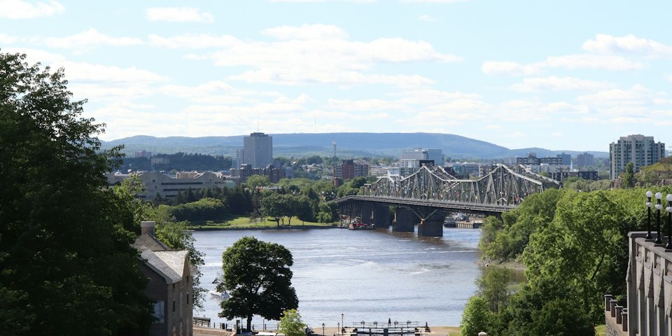 View over the Ottawa River toward the Alexandra Bridge and the Gatineau Hills